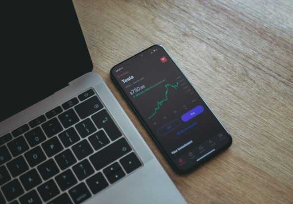 black android smartphone on macbook pro