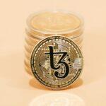 a stack of coins sitting on top of a table