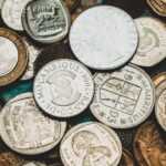 a pile of different types of coins