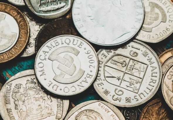 a pile of different types of coins