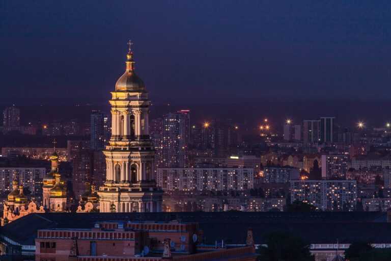 white and green tower during night time