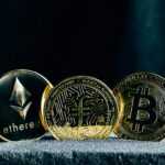 three bitcoins sitting on top of a table